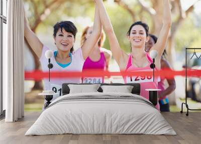 Two Female Runners Finishing Race Together Wall mural