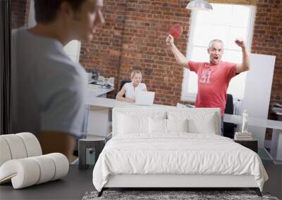 Two men in office space playing ping pong Wall mural