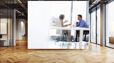 two people talking in an office Wall mural