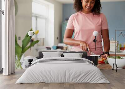 Woman Preparing Batch Of Healthy Meals At Home In Kitchen Wall mural