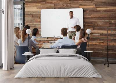 young black man at whiteboard giving a business presentation Wall mural