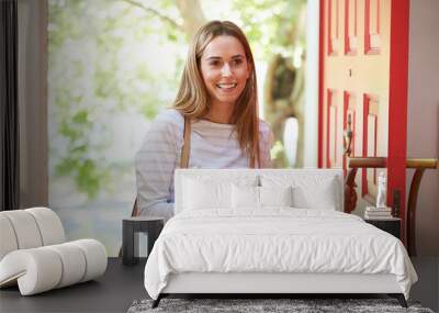 Young Woman Returning Home For Work With Shopping Wall mural