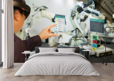 iot industry 4.0 concept,industrial engineer(blurred) using smart glasses with augmented mixed with virtual reality technology to monitoring machine in real time.Smart factory use Automation robot arm Wall mural