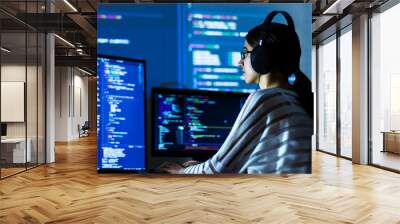 Software developer freelancer woman female in glasses work with program code C++ Java Javascript on wide displays at night Develops new web desktop mobile application or framework Projector background Wall mural