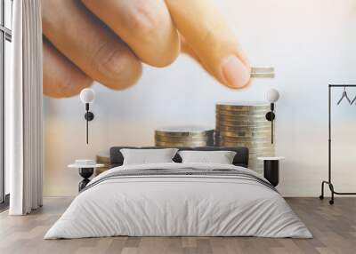 Concept save money financial business investment. Hand of male putting coins stack step growing growth value Wall mural