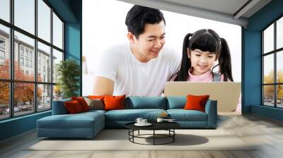 Father and daughter learning education study online class. Kid girl and dad using computer laptop at home Wall mural