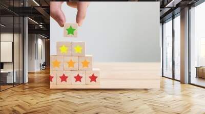 Hand arranging wood block stacking with icon five star symbol. Rating customer service satisfaction experience concept Wall mural