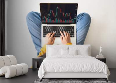 Investment financial stock market concept. Top view woman using computer laptop with application trading stock on screen device Wall mural