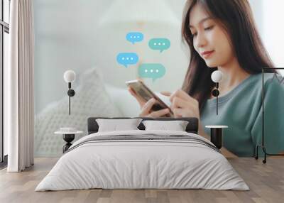 Woman using mobile smartphone. Online live chat chatting on application communication digital media website and social network Wall mural