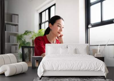 Work from home concept, Portrait of beautiful young asian woman working on laptop in workplace Wall mural