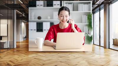 Work from home concept, Portrait of beautiful young asian woman working on laptop in workplace Wall mural