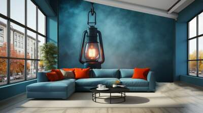 A vintage lantern glowing softly in a misty atmosphere, evoking warmth and nostalgia in a serene setting. Wall mural