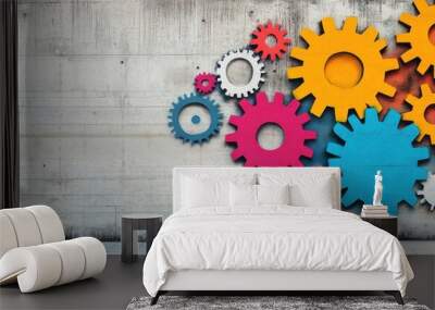 Colorful gears on a textured wall create a vibrant and dynamic visual for design and engineering themes. Wall mural