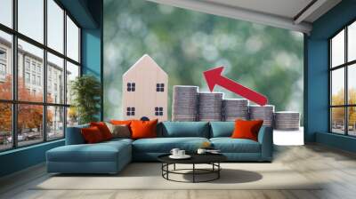 mortgage,model house and stack of coins money on natural green background,business investment and re Wall mural