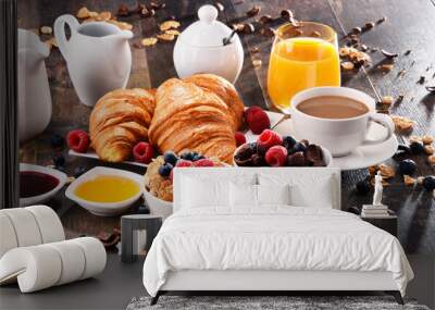 Breakfast served with coffee, juice, croissants and fruits Wall mural