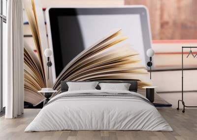 Composition with books and tablet computer on the table Wall mural