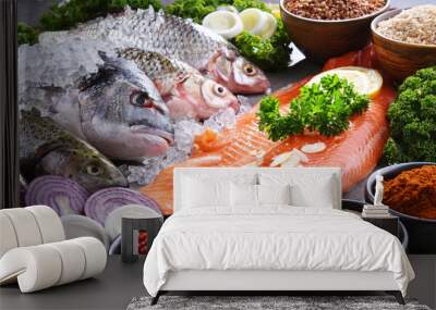 Different sorts of fish on kitchen table Wall mural