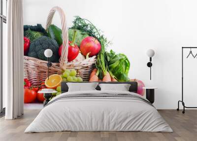 Fresh organic fruits and vegetables in wicker basket Wall mural