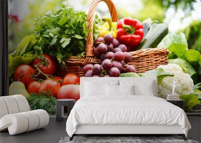 Fresh organic vegetables in wicker basket in the garden Wall mural