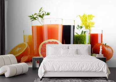 glasses with fresh organic vegetable and fruit juices on white Wall mural