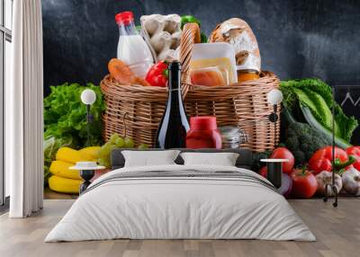 Wicker basket with assorted grocery products Wall mural