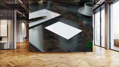 Blank white card mockup on a wooden desk with coffee, pen, and plant. Wall mural