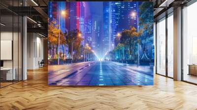 A wide, empty street in a modern city at night. The street is lined with tall buildings and trees, and the only light comes from the street lamps and the lights in the buildings. Wall mural