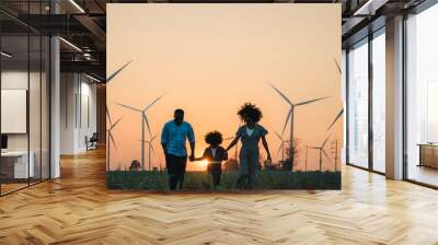 family looking windmills. African American family in the community with wind generators turbines, Wind turbines are alternative electricity sources, sustainable resources and Renewable energy. Wall mural