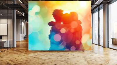 Group of friends embracing in a warm, colorful abstract light background, symbolizing unity, friendship, and joy. Wall mural