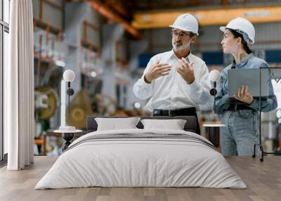 Portrait of female engineer team standing and working in industrial factory. Professional engineering, worker, woman Quality control. Male and female industrial engineers using tablet computer. Wall mural