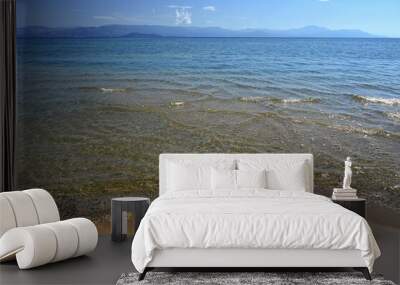 Beautiful beach with sea, sun and blue sky. Concept for travel and summer vacation. Greece-island of Corfu. Wall mural