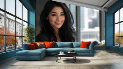 A professional woman smiles while working on her laptop in a modern high-rise office setting Wall mural