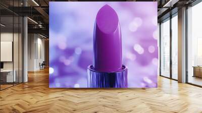 A purple lipstick is on a purple background. The lipstick is shiny and has a purple tint Wall mural