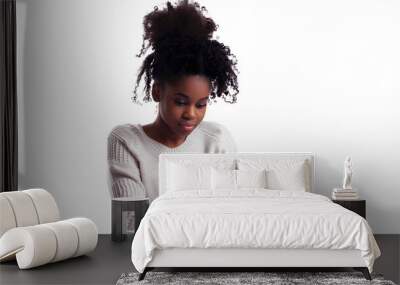 A young black female working on laptop computer isolated on transparent background Wall mural