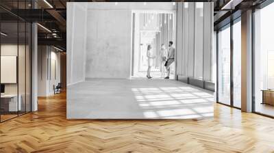 Black and white photo of business people discussing plans before meeting Wall mural