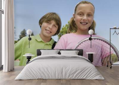 Brother and Sister with Tennis Racket at tennis court portrait close up Wall mural