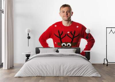 Caucasian man with hand on hips whilst wearing a christmas jumper Wall mural