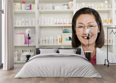 Closeup portrait of a confident smiling female pharmacist Wall mural