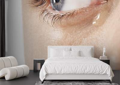 Detailed image of man's eye with tears isolated on white background Wall mural