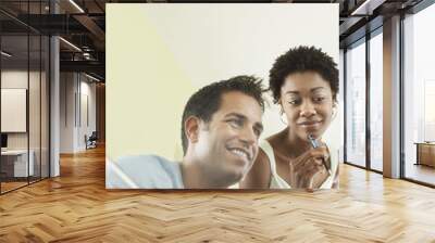 Multiethnic business people busy working over laptop in conference room Wall mural