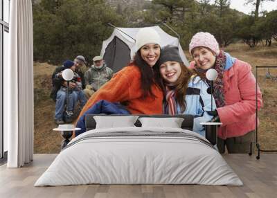 Three generational women with family camping during winter Wall mural