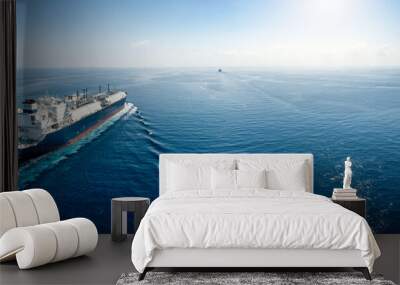 A big LNG tanker ship travelling over the calm, blue ocean as a concept for international fuel industry with copy space Wall mural