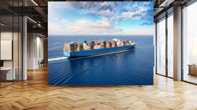 A large container cargo ship travels over calm, blue ocean Wall mural