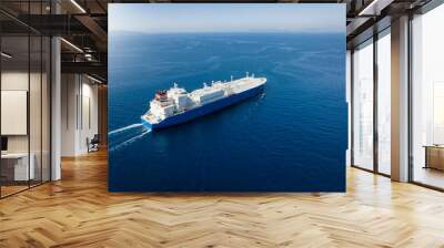 Aerial view of a large LNG or liquid gas tanker ship traveling over blue ocean, with copy space Wall mural