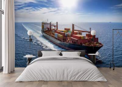 Aerial view of aloaded container cargo vessel traveling with high speed over blue sea Wall mural