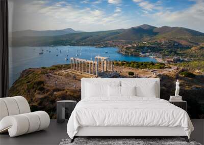 Aerial view of the beach and Temple of Poseidon at Cape Sounion at the edge of Attica, Greece, during summer sunset time Wall mural