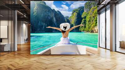 Happy tourist woman in white summer dress relaxing on boat at the beautiful Phi Phi islands, Tourism Phuket, Krabi, travel concept for Thailand Wall mural