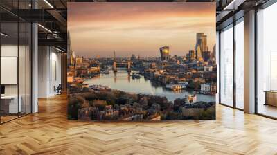 Panoramic, aerial view to the urban skyline of London during a golden sunrise with Tower Bridge and the skyscrapers of the City district, United Kingdom Wall mural