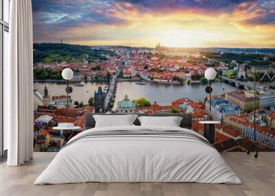 Panoramic aerial summer sunset view of the skyline of Prague, Czech Republic, with old Lesser town, Vltava river and castle Wall mural