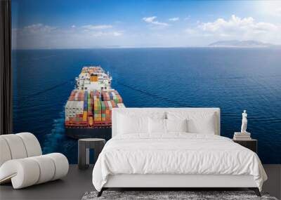 Panoramic back view of a cargo ship carrying containers for import and export, business logistic and transportation in open sea with copy space  Wall mural